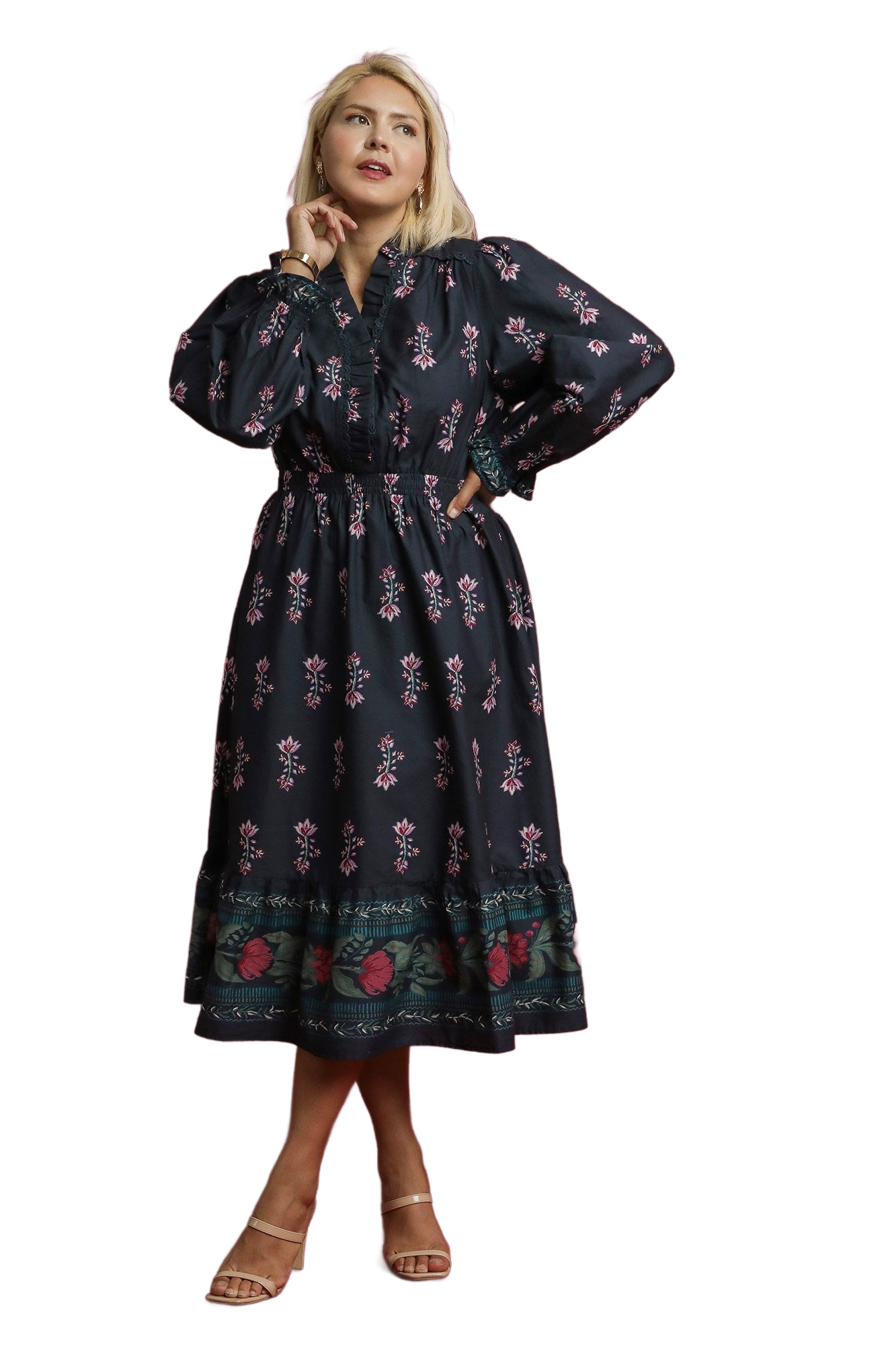 Woman wearing a dark floral dress on a white background